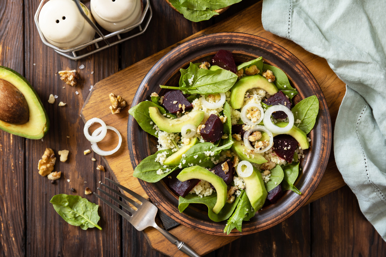 Vegan food, low calories dieting meal.Couscous with avocado, bee